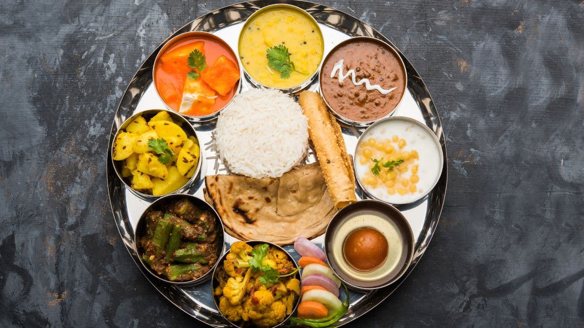 Gujarati thali dining spread at The Grand Atmij Restaurant in Rajkot